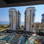 ID 5196 Stylish 1+1 apartment on the beachfront in Mahmutlar