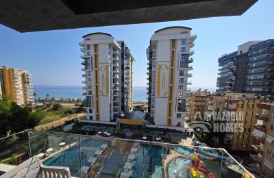 ID 5196 Stylish 1+1 apartment on the beachfront in Mahmutlar